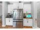 Modern kitchen design showcasing stainless steel appliances, a large refrigerator, and bright cabinetry at 19412 Lonesome Pine Dr, Land O Lakes, FL 34638