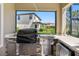 Outdoor kitchen featuring stainless steel appliances and a stone backsplash at 19412 Lonesome Pine Dr, Land O Lakes, FL 34638