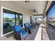 Relaxing screened patio featuring comfortable seating and a ceiling fan for added comfort at 19412 Lonesome Pine Dr, Land O Lakes, FL 34638