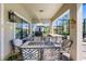 Enjoy outdoor dining on this covered patio, complete with a grill area and serene neighborhood views at 19412 Lonesome Pine Dr, Land O Lakes, FL 34638