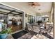 Spacious covered patio featuring an outdoor dining area and a seamless transition to the indoor kitchen at 19412 Lonesome Pine Dr, Land O Lakes, FL 34638