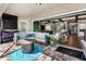 Relax on the covered patio, featuring comfortable seating and views of the home's interior and backyard at 19412 Lonesome Pine Dr, Land O Lakes, FL 34638