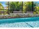 Gorgeous pool with waterfalls, stone accents, and beautiful landscaping at 19412 Lonesome Pine Dr, Land O Lakes, FL 34638