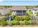 A backyard complete with playset, screened in pool, lush landscaping and mature trees at 19412 Lonesome Pine Dr, Land O Lakes, FL 34638