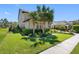 Well-maintained side yard with lush green lawn, trimmed hedges, and blooming flowers at 19412 Lonesome Pine Dr, Land O Lakes, FL 34638