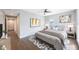 This staged bedroom offers hardwood floors, neutral paint, and ample space at 199 Dali Blvd # 804, St Petersburg, FL 33701