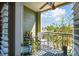 This balcony features a small table and chairs, a ceiling fan, and beautiful city views at 2010 E Palm Ave # 15210, Tampa, FL 33605