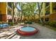 This courtyard features manicured landscaping and a water fountain as a focal point at 2010 E Palm Ave # 15210, Tampa, FL 33605