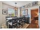 Elegant dining room with a large table, stylish chairs, and unique chandelier lighting fixture at 2010 E Palm Ave # 15210, Tampa, FL 33605