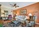 Inviting living area featuring hardwood floors, a comfortable sofa, and stylish furnishings with a ceiling fan at 2010 E Palm Ave # 15210, Tampa, FL 33605