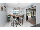 Bright breakfast nook with a view of the waterfront and access to the outdoor living space at 22322 Tennyson Ave, Port Charlotte, FL 33954