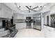 Modern kitchen with stainless steel appliances, granite countertops, and white cabinetry at 22322 Tennyson Ave, Port Charlotte, FL 33954