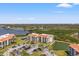 Aerial view of community complex features waterfront access, landscaping, and parking at 234 Mariner Dr # 234, Tarpon Springs, FL 34689