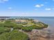 Stunning aerial view of waterfront condos surrounded by mangroves and crystal-clear water at 234 Mariner Dr # 234, Tarpon Springs, FL 34689