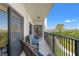 Relaxing balcony with comfortable wicker furniture and scenic views of lush greenery at 234 Mariner Dr # 234, Tarpon Springs, FL 34689