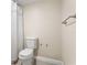 Bathroom featuring toilet, shower with white curtain, neutral wall, and tile flooring at 234 Mariner Dr # 234, Tarpon Springs, FL 34689