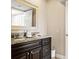 Bathroom features a vanity with granite countertops, a mirror, and a white storage basket at 234 Mariner Dr # 234, Tarpon Springs, FL 34689