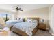 Bedroom features two twin beds, a ceiling fan, and access to a balcony with outdoor views at 234 Mariner Dr # 234, Tarpon Springs, FL 34689