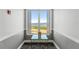 Bright hallway features a decorative table and window with a water view at 234 Mariner Dr # 234, Tarpon Springs, FL 34689