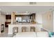 Kitchen bar with granite countertops and seating, with stainless steel appliances at 234 Mariner Dr # 234, Tarpon Springs, FL 34689