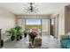 Bright living room with a large window, stylish furniture, and tasteful decor at 234 Mariner Dr # 234, Tarpon Springs, FL 34689