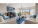 Cozy living room featuring a fireplace, comfortable seating, and bright natural light at 234 Mariner Dr # 234, Tarpon Springs, FL 34689