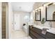 Elegant bathroom with a double vanity, modern fixtures, and ample storage space for a spa-like experience at 24941 Ravello St, Land O Lakes, FL 34639