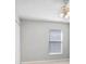 Neutral bedroom featuring tile floors, one window, and a ceiling fan offering a serene and comfortable space at 24941 Ravello St, Land O Lakes, FL 34639