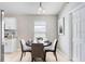 Cozy dining nook boasts a round table, stylish chairs, and a view to the bright kitchen for easy entertaining at 24941 Ravello St, Land O Lakes, FL 34639