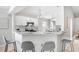 Bright kitchen featuring white cabinets, granite countertops, and stainless steel appliances at 24941 Ravello St, Land O Lakes, FL 34639