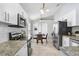 Updated kitchen with white cabinets, granite countertops and stainless steel appliances at 24941 Ravello St, Land O Lakes, FL 34639