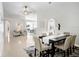 Open-concept living and dining area with tile flooring, recessed lighting, and an airy, spacious design at 24941 Ravello St, Land O Lakes, FL 34639