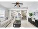 Open-concept living room with a partial view of the kitchen and dining area at 24941 Ravello St, Land O Lakes, FL 34639