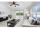 Inviting living room with sliding glass doors to screened patio for seamless indoor/outdoor living at 24941 Ravello St, Land O Lakes, FL 34639