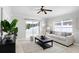 Inviting living room with sliding glass doors to screened patio for seamless indoor/outdoor living at 24941 Ravello St, Land O Lakes, FL 34639