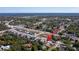 Beautiful aerial view of the neighborhood with a lake in the background at 2516 Leafwing Ct, Palm Harbor, FL 34683