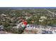 Expansive aerial view of property location surrounded by lush greenery in a desirable neighborhood at 2516 Leafwing Ct, Palm Harbor, FL 34683