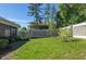 Expansive backyard with well-maintained lawn and decorative privacy fence at 2516 Leafwing Ct, Palm Harbor, FL 34683