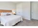 Spacious bedroom featuring neutral carpet, and a large comfortable bed at 2516 Leafwing Ct, Palm Harbor, FL 34683