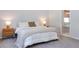 Cozy bedroom with carpet flooring, neutral tones, and bedside tables at 2516 Leafwing Ct, Palm Harbor, FL 34683