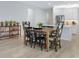 Open dining area adjacent to the kitchen with a stylish wooden table at 2516 Leafwing Ct, Palm Harbor, FL 34683