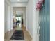 Welcoming foyer with light hardwood floors and a view into the open living space at 2516 Leafwing Ct, Palm Harbor, FL 34683