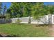 A long, low, modern grey stone and concrete perimeter fence at 2516 Leafwing Ct, Palm Harbor, FL 34683