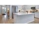 Modern kitchen with stainless steel appliances and a large center island at 2516 Leafwing Ct, Palm Harbor, FL 34683