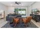 Cozy living room with a large sectional sofa and sliding doors to the patio at 2516 Leafwing Ct, Palm Harbor, FL 34683