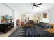 Open floor plan with view from living room to dining area and modern kitchen at 2516 Leafwing Ct, Palm Harbor, FL 34683