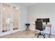 Bright office space with glass doors, office chair, and dual monitors at 2516 Leafwing Ct, Palm Harbor, FL 34683
