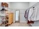 Spacious walk-in closet with custom shelving, drawers, and storage options at 2516 Leafwing Ct, Palm Harbor, FL 34683