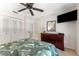 Cozy bedroom featuring a dresser with a mirror and TV at 2700 Bayshore Blvd # 512, Dunedin, FL 34698