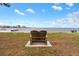 Peaceful waterfront view with a comfortable bench, perfect for relaxation and enjoying the scenery at 2700 Bayshore Blvd # 512, Dunedin, FL 34698